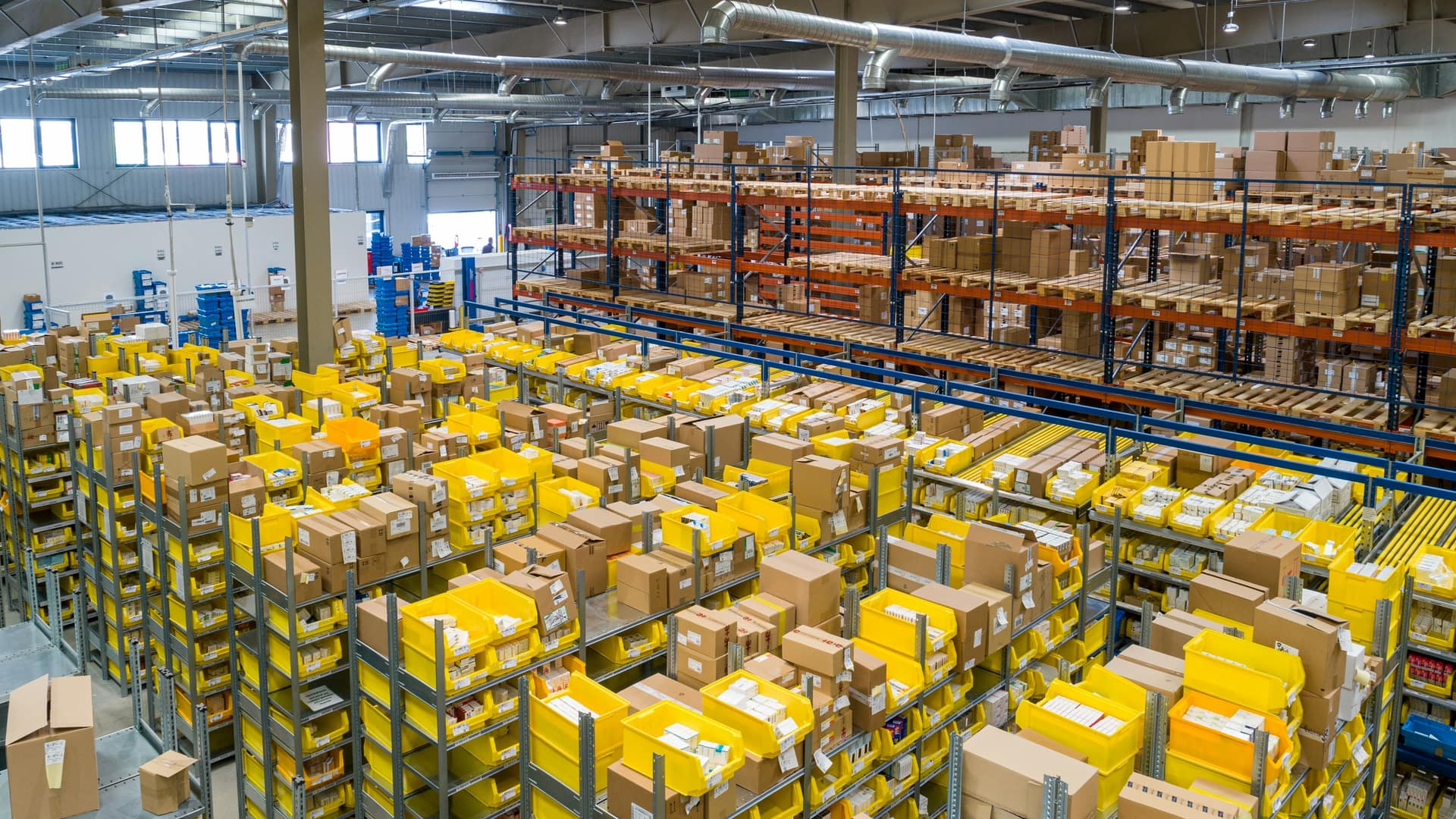Modern warehouse interior with organized high-density racking, serving as the operational backbone of SamVertex fulfillment